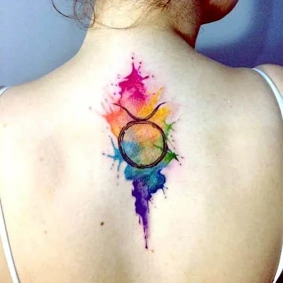 colorful watercolor taurus tattoo on the back