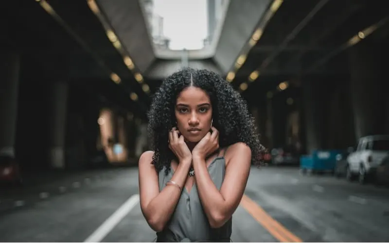 Confident african american woman standing on the middle of the road