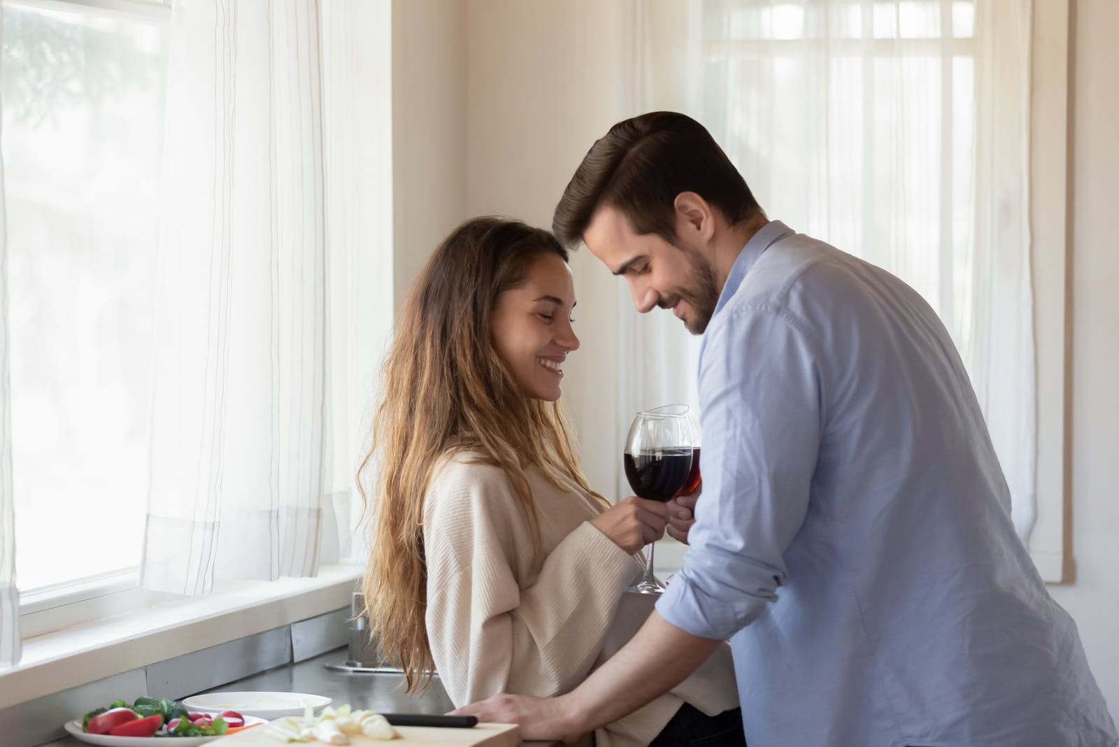 couple flirting in the kitchen