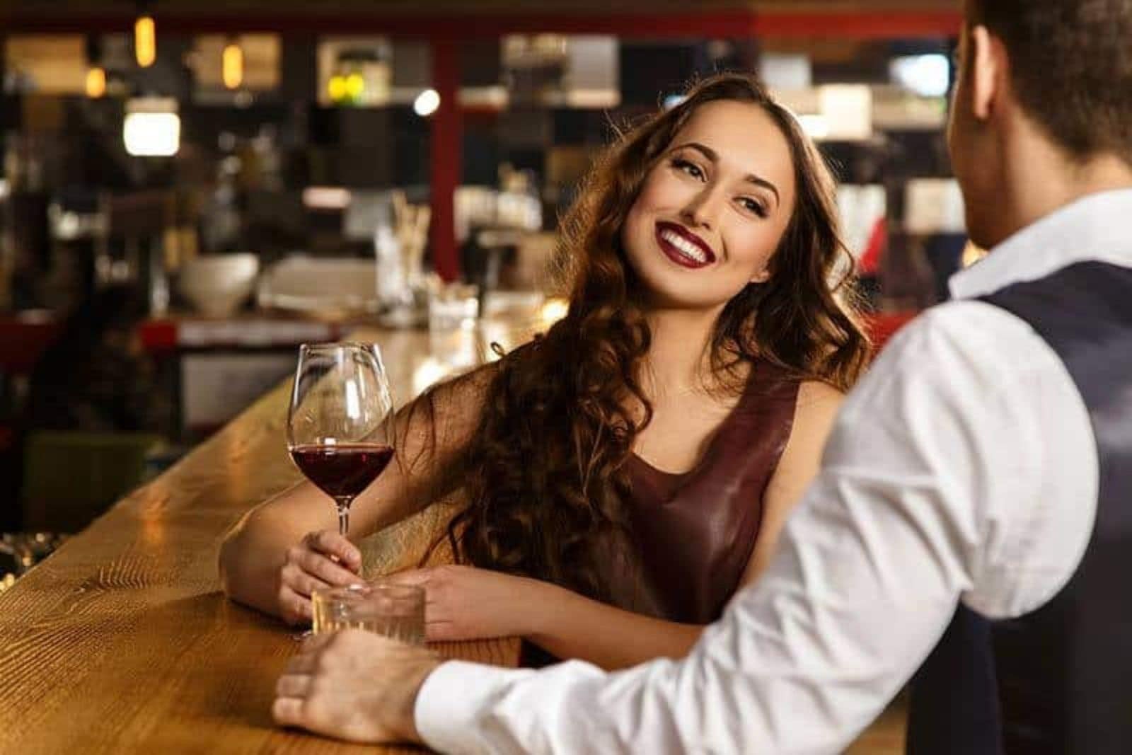 couple having conversation at bar