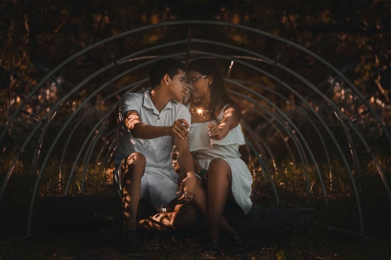 couple holding sparklers