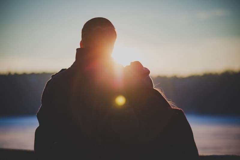 couple hugging during golden hour