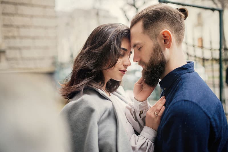 couple in love cuddling on the street