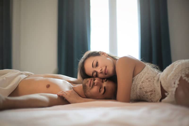 couple lying on the bed together