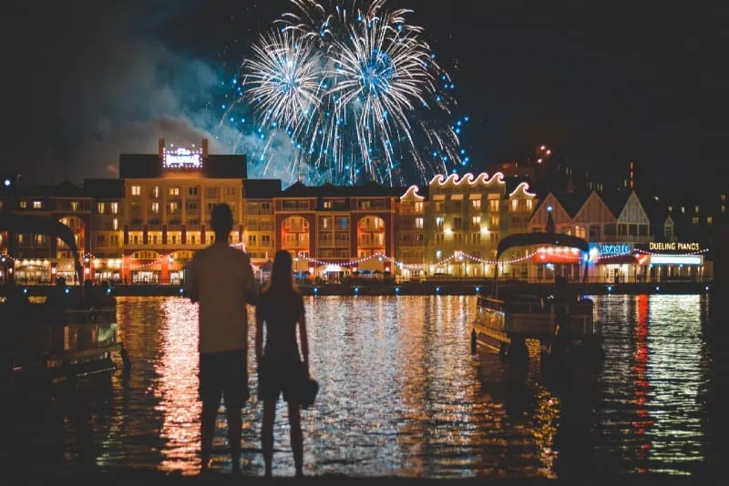 man and woman watching fireworks