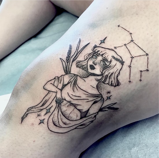 cute cartoonish illustration and Virgo constellation tattoo on the knee