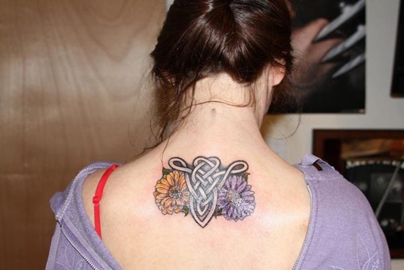 Dahlia theme Aries upper back tattoo