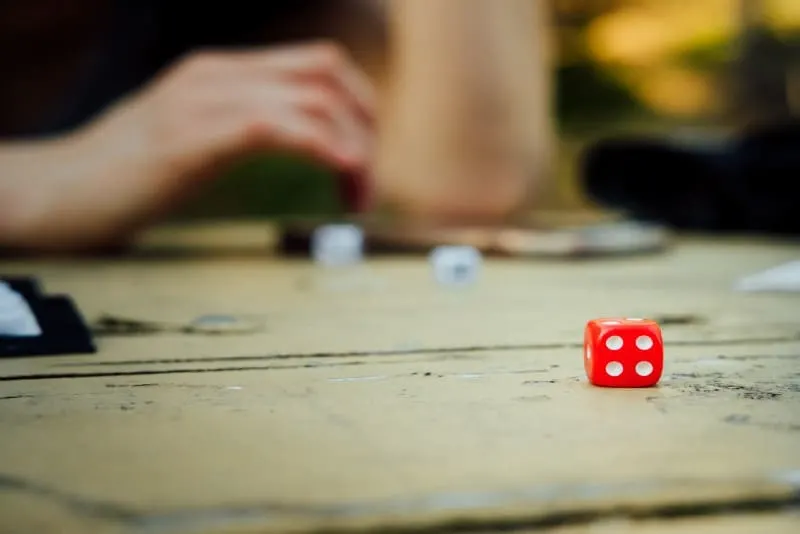 red dice on wooden table