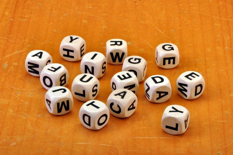 letter dices on vintage table