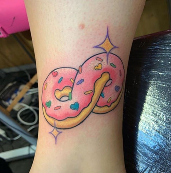 colorful donut tattoo with stars