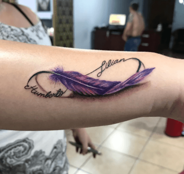 purple feather and names infinity tattoo