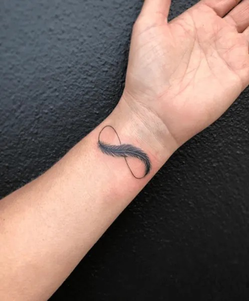 feather infinity tattoo on arm