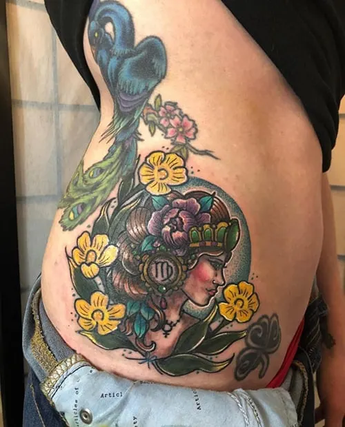 floral Virgo tattoo on the hip