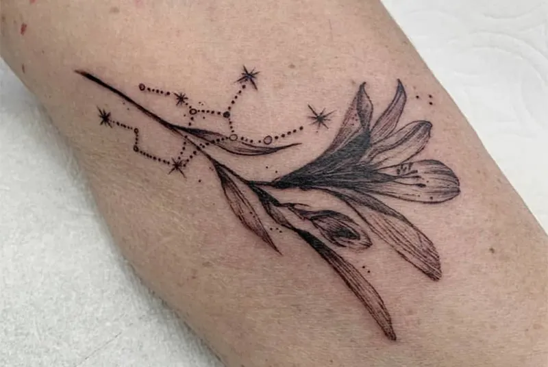  flower tattoo with a Virgo constellation