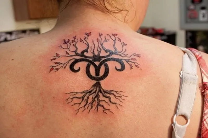 flowering tree Aries tattooon the upper back