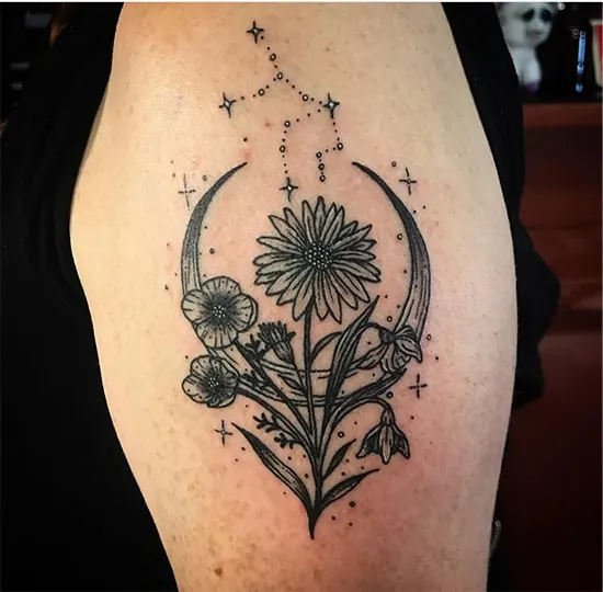flowers with a crescent moon tattoo with Virgo constellation above