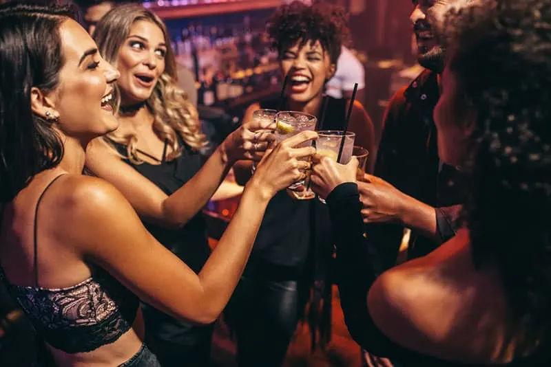 friends making a toast in the club