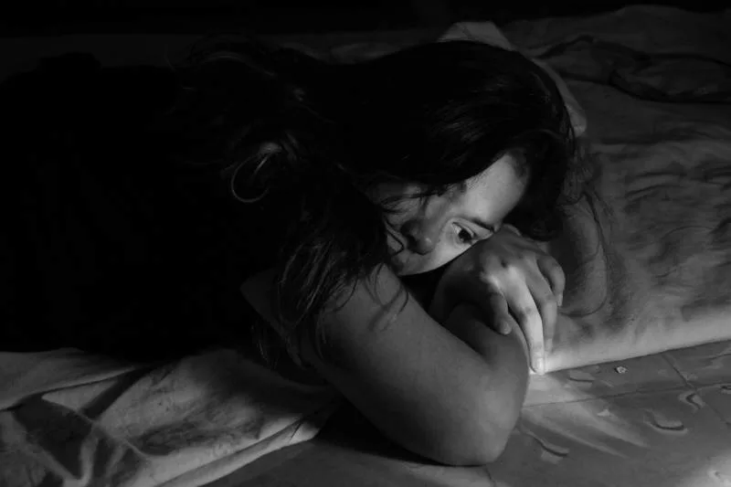 girl lying on the bed