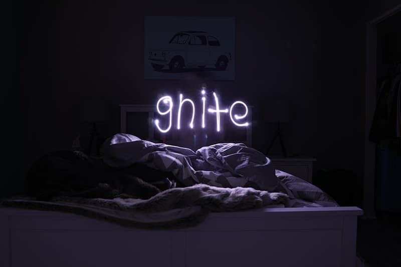 good night neon sign above the bed