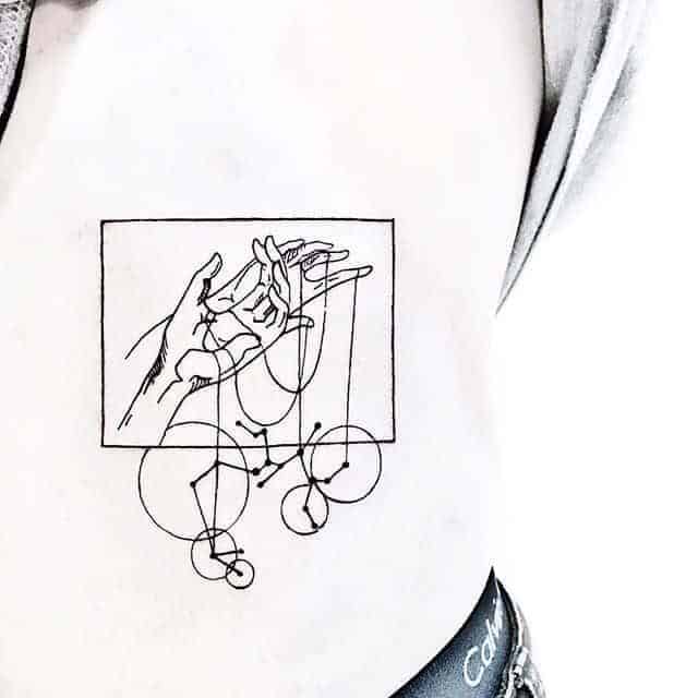 hands holding sagittarius constellation tattoo in the rectangle