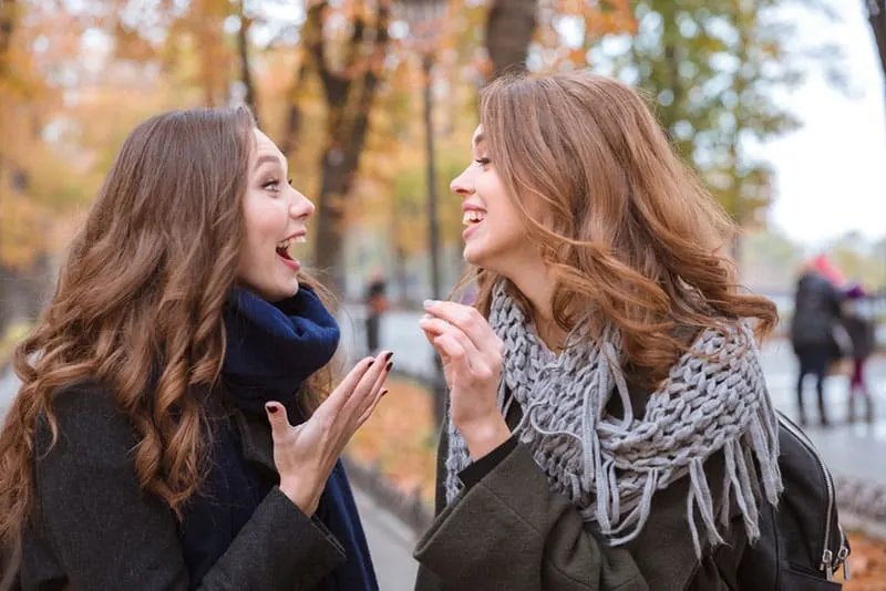 happy women talking on the street