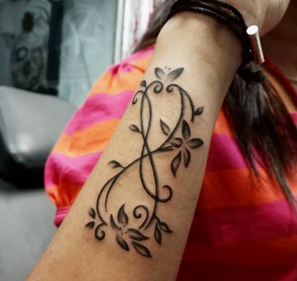 infinity tattoo with simple line art flowers