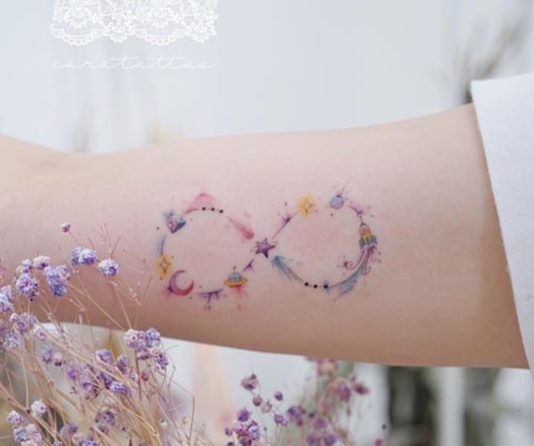 pastel infinity tattoo with space theme