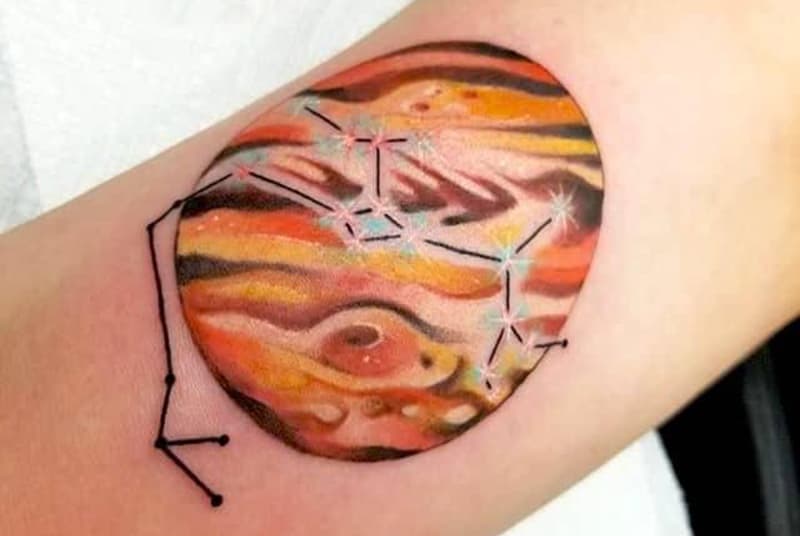 jupiter and sagaittarius tattoo on the arm