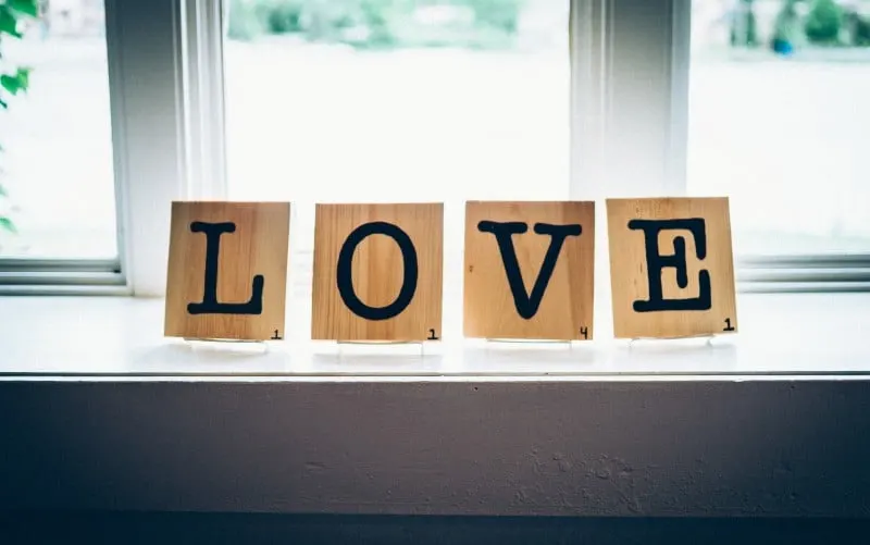 Love word written with wood squares