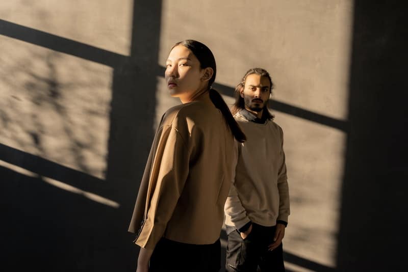 man and woman far from each other wearing brown sweat shirts