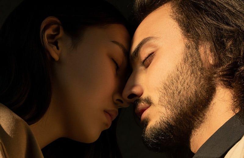 man and woman feeling each other head to head in focus