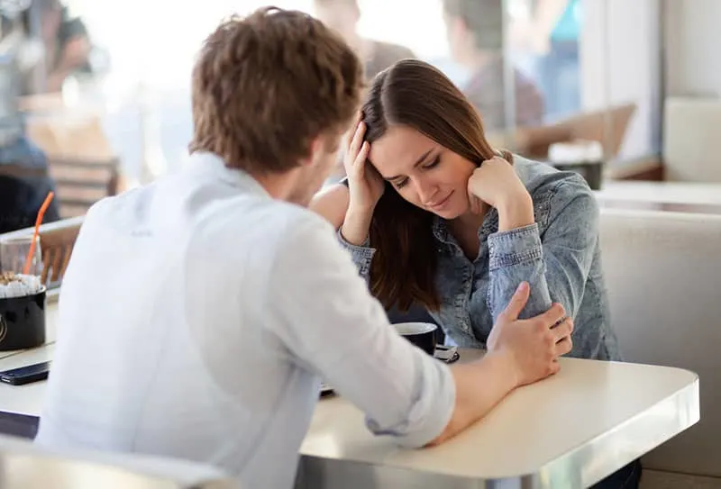 man breaking up with sad woman