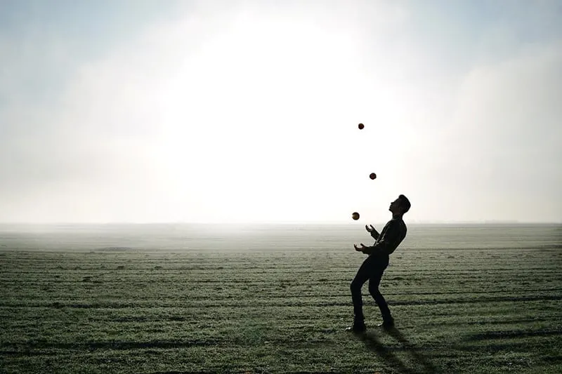 man juggling in the field