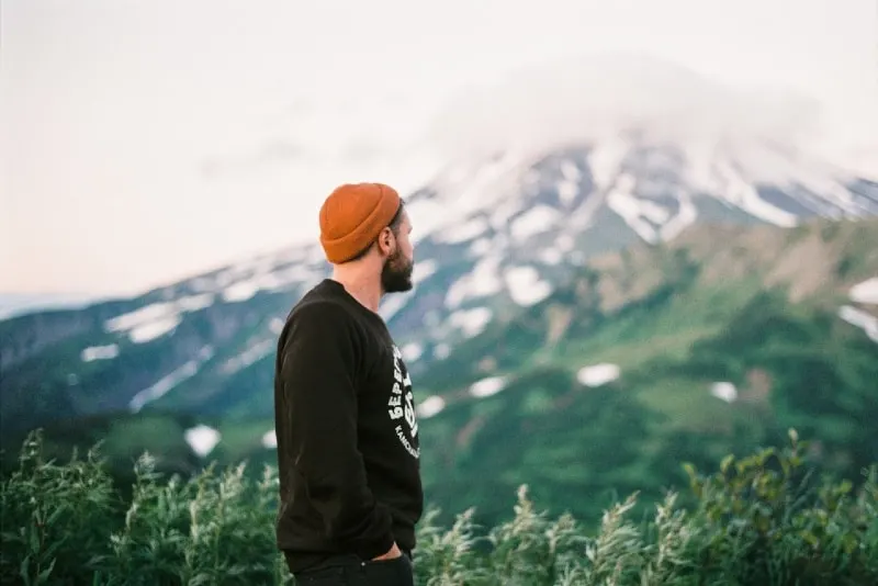 bearded man looking at mountain