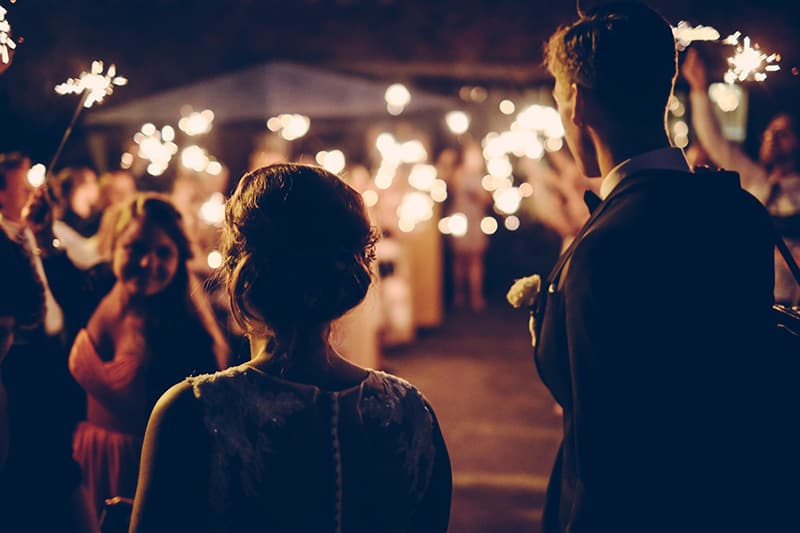 man standing near the woman at wedding party