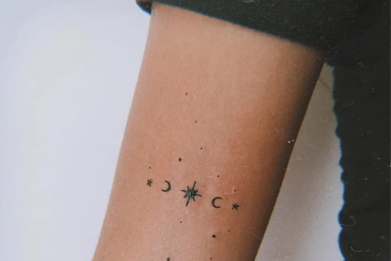 minimal Virgo constellation tattoo on the arm
