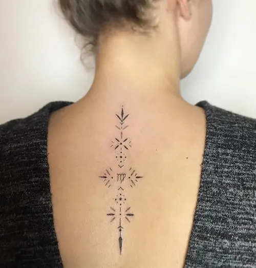 minimal Virgo tattoo on the back
