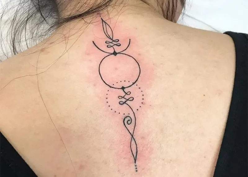 minimalist design taurus symbol tattoo on the back