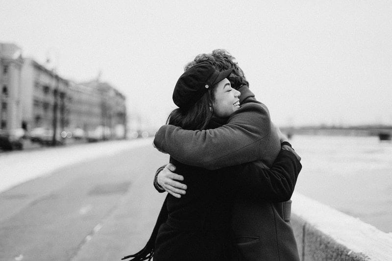 monochrome photo of couple hugging each other 