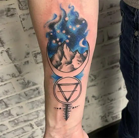 moon and mountain tattoo with blue night sky