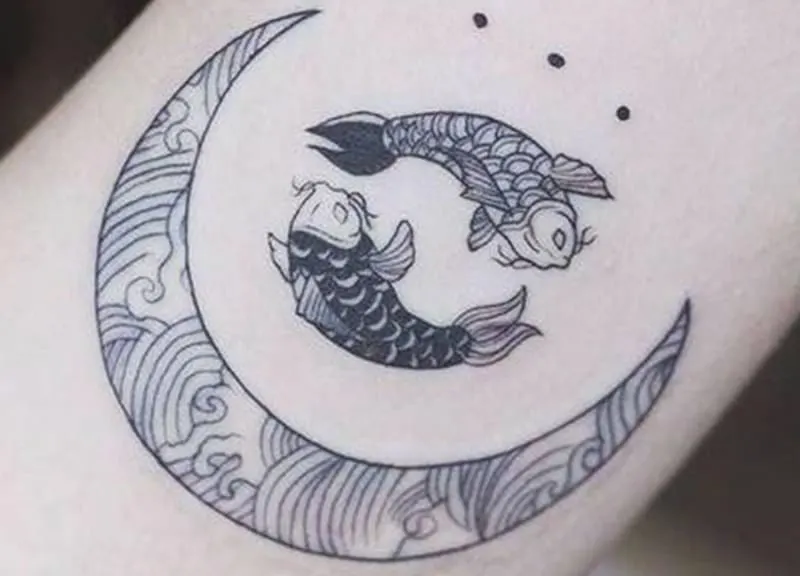 moon and pisces tattoo with three black dots