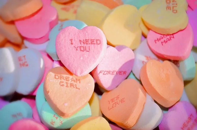 multicolor heart shaped candies with notes