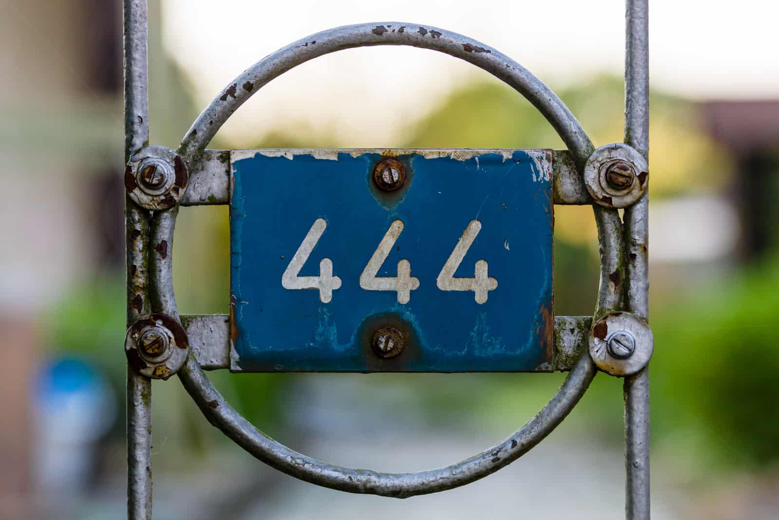 number 444 on a wrought iron fence