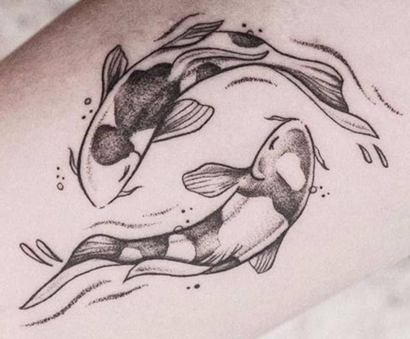 pencil-drawn looking tattoo of pisces
