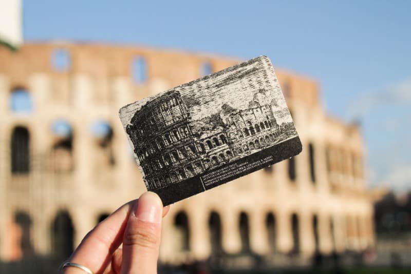 woman holding colosseum ticket