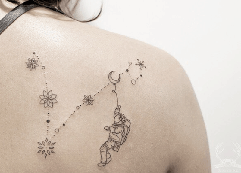 pisces constellation tattoo with astronaut