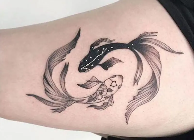 pisces tattoo with yin yang symbolism and with constellation