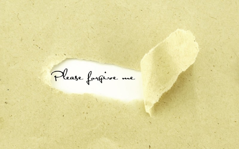 Please forgive me written on torn old light colored paper