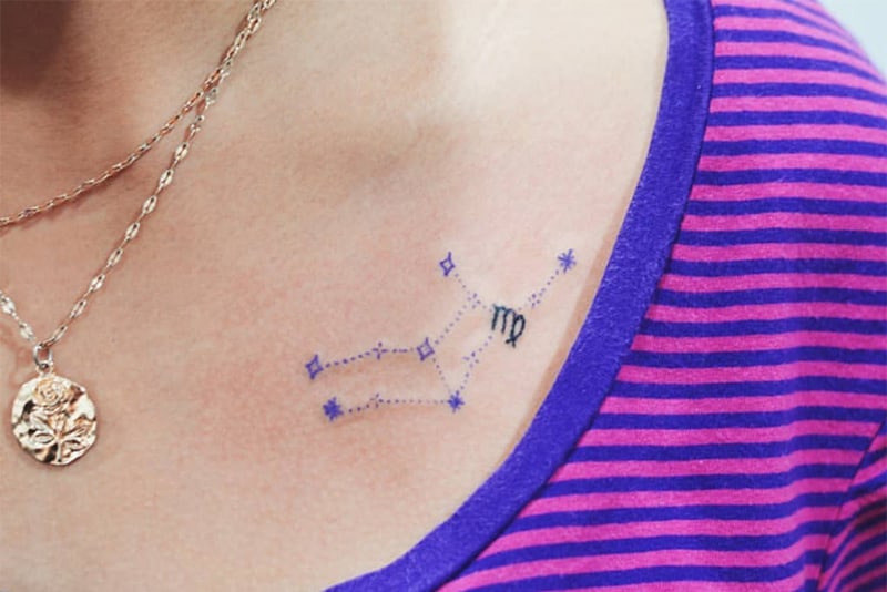purple Virgo constellation tattoo under the collar bone
