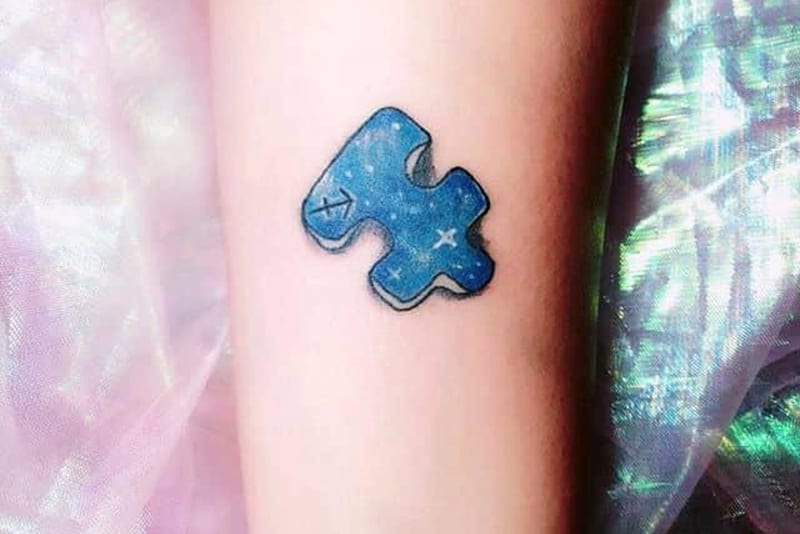 tatuaje de pieza de puzzle para sagitario